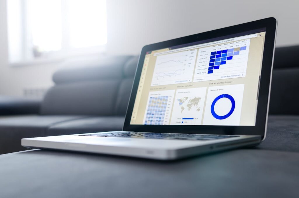 Mastering the First Impression: Your intriguing post title goes here Sleek laptop showcasing data analytics and graphs on the screen in a bright room.